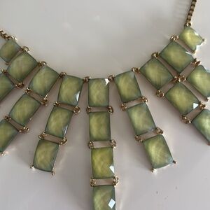 Necklace with faceted green stones